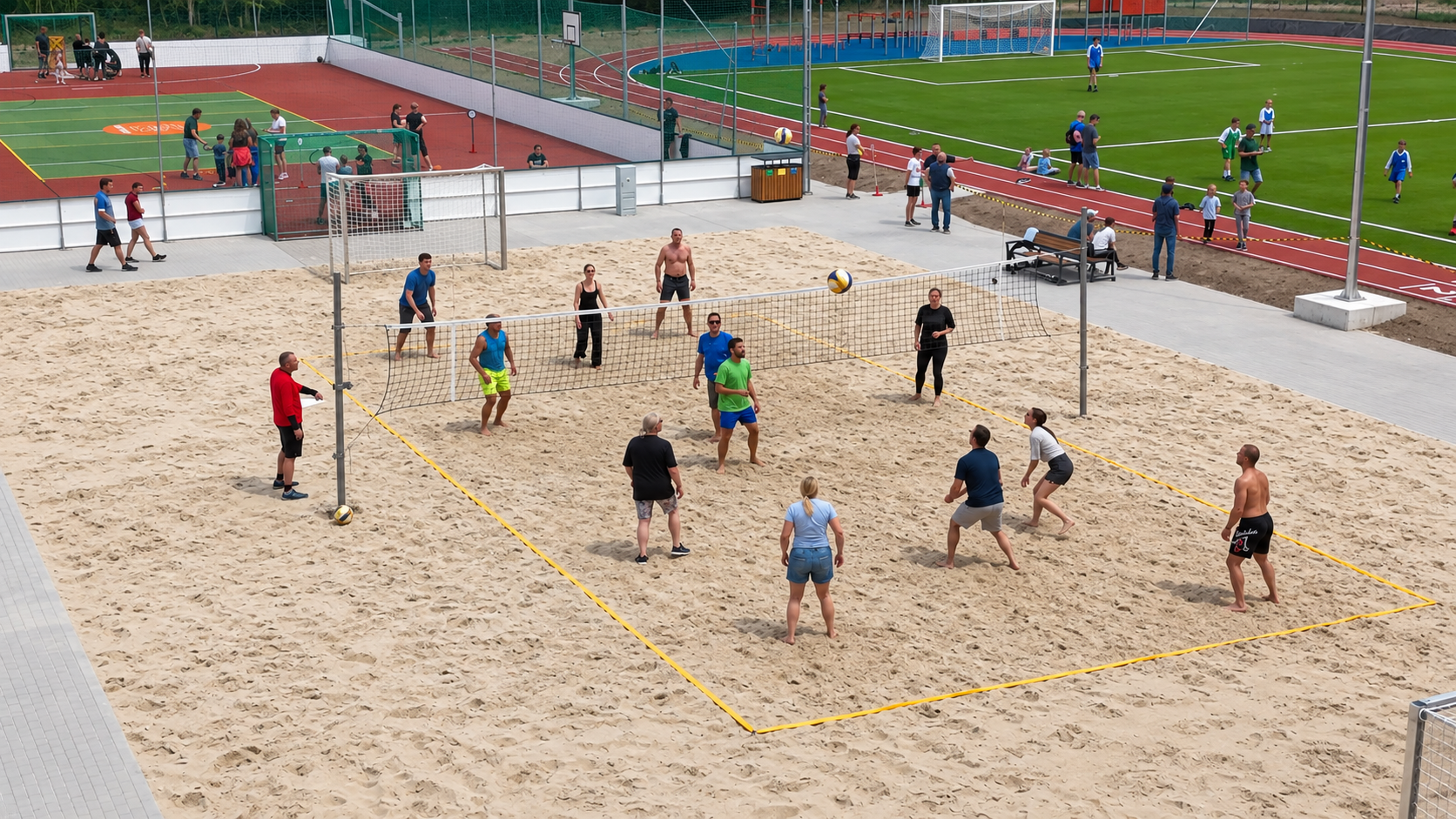 People playing beach volleyball on a sand court beside other sports grounds.