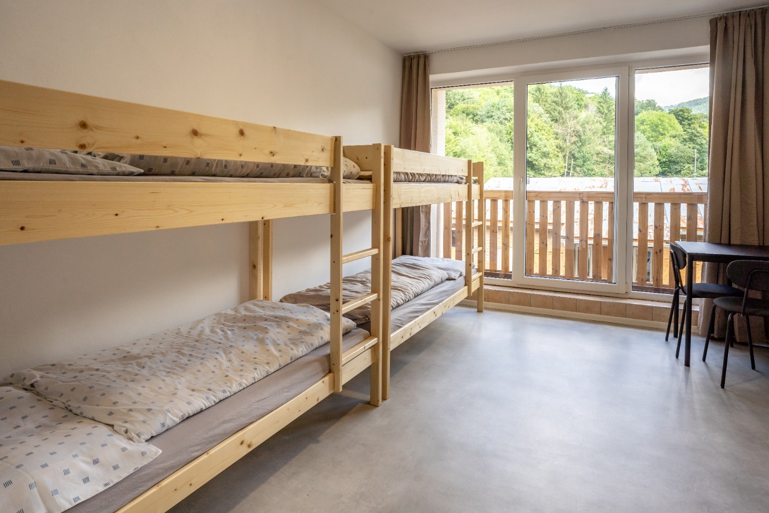 Bunk-bed room with balcony access at Cabin Retreat