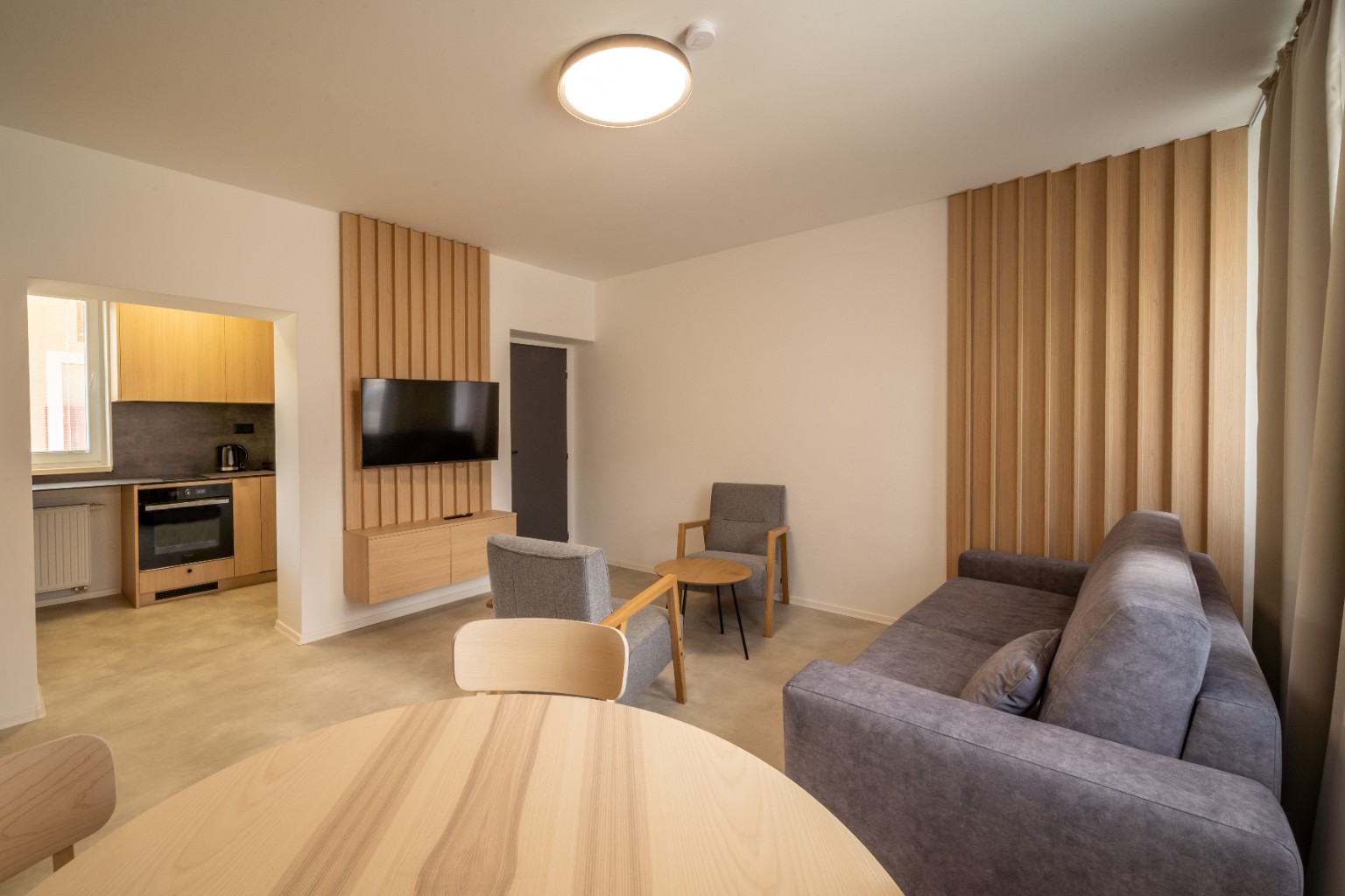 Living and dining area inside Cabin Retreat accommodation