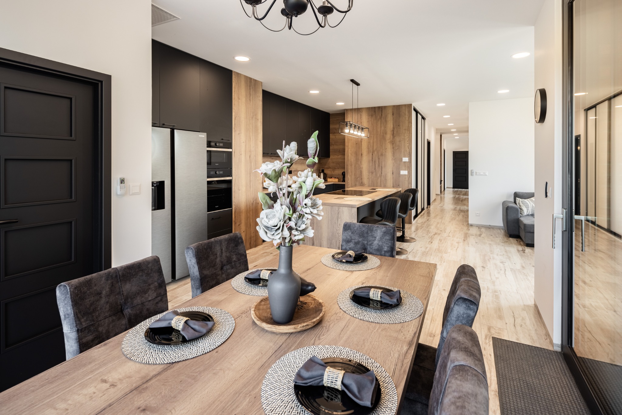 Set dining table beside the kitchen at The Riverview 3BR Luxury Residence Piešťany